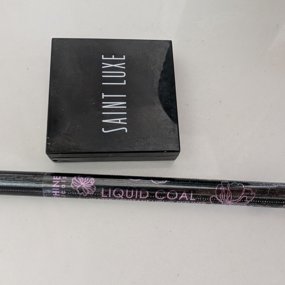 Seraphine botanicals liquid coal eyeliner & Sainte Luxe rose quartz highlighter